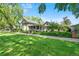 Beautiful house with a big yard, trees, and a sidewalk at 3109 E Warren Ave, Denver, CO 80210