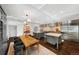 Spacious kitchen and dining area with hardwood floors, modern appliances, two islands, and recessed lighting at 3109 E Warren Ave, Denver, CO 80210