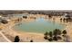 Community aerial view showcasing a pond, walking paths, and mature trees with surrounding houses at 11041 Richfield Cir, Commerce City, CO 80022