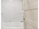 Relaxing bathroom featuring a soaking tub with marble-like tile surround, complemented by modern fixtures at 11041 Richfield Cir, Commerce City, CO 80022