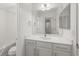 Contemporary bathroom with double mirror, vanity, and tub-shower combination at 11041 Richfield Cir, Commerce City, CO 80022