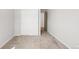Carpeted bedroom featuring a closet with sliding doors and neutral-colored walls at 11041 Richfield Cir, Commerce City, CO 80022