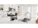 Bright kitchen features stainless steel appliances and quartz countertops at 11041 Richfield Cir, Commerce City, CO 80022