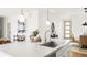Bright kitchen features white paneling and an undermount sink at 11041 Richfield Cir, Commerce City, CO 80022