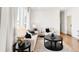 Bright living room featuring modern furnishings, neutral color palette, and decorative details at 11041 Richfield Cir, Commerce City, CO 80022