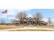 Inviting restaurant exterior showcasing architectural details, covered porch, and American flag waving proudly at 11041 Richfield Cir, Commerce City, CO 80022