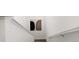 Close-up of a staircase with white railings and neutral walls at 11041 Richfield Cir, Commerce City, CO 80022