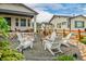 Backyard includes patio, chairs, fire pit, and beautiful landscaping at 4465 Mesa Top Dr, Monument, CO 80132