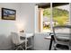 Bright home office featuring a desk with a view of the greenery outside at 4465 Mesa Top Dr, Monument, CO 80132