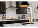 This gourmet kitchen features stainless steel appliances and modern finishes at 4465 Mesa Top Dr, Monument, CO 80132