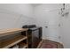 Laundry room featuring updated washer and dryer with nearby shelf and storage space at 4465 Mesa Top Dr, Monument, CO 80132