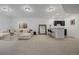 Spacious living room boasts plush seating, wet bar, and plenty of room to relax and entertain at 4465 Mesa Top Dr, Monument, CO 80132
