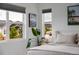 This sun-filled main bedroom features multiple windows and views at 4465 Mesa Top Dr, Monument, CO 80132