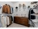 Spacious walk-in closet featuring wire shelving and a wood dresser for optimal organization at 4465 Mesa Top Dr, Monument, CO 80132
