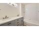 Bathroom featuring double sinks, modern fixtures, and a shower-tub combo at 8500 E Jefferson # 3C, Denver, CO 80237