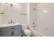 Clean bathroom with modern vanity, white tiled shower-tub, and contemporary fixtures at 8500 E Jefferson # 3C, Denver, CO 80237