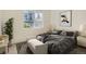 Comfortable bedroom featuring a plush bed, modern decor, and a window offering natural light at 8500 E Jefferson # 3C, Denver, CO 80237