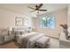 Serene bedroom with a comfortable bed, soft neutral colors, and a large window overlooking the neighborhood at 8500 E Jefferson # 3C, Denver, CO 80237