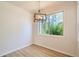 Dining room with a modern chandelier, big window and wood flooring at 8500 E Jefferson # 3C, Denver, CO 80237
