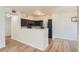 Contemporary kitchen featuring dark cabinets, stainless steel appliances, and a breakfast bar at 8500 E Jefferson # 3C, Denver, CO 80237