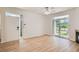 Inviting living room with wood floors, a bright entrance door, and sliding glass doors at 8500 E Jefferson # 3C, Denver, CO 80237