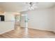 Spacious living room with ample natural light, ceiling fan and updated flooring at 8500 E Jefferson # 3C, Denver, CO 80237