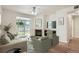 Bright living room with a fireplace, modern furnishings, and sliding glass doors leading to a private outdoor space at 8500 E Jefferson # 3C, Denver, CO 80237