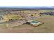 Aerial view of community pool and park area surrounded by lush green landscapes and scenic mountain views at 13673 Osage St, Broomfield, CO 80023