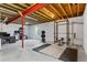 Large unfinished basement with exposed beams, concrete floor, and potential for a home gym at 13673 Osage St, Broomfield, CO 80023