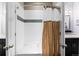 Well-maintained bathroom equipped with bathtub, shower, glass door and a decorative shower curtain at 13673 Osage St, Broomfield, CO 80023