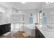 Luxurious bathroom with a soaking tub, glass-enclosed shower, and dual vanities at 13673 Osage St, Broomfield, CO 80023