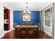 Formal dining room featuring a modern chandelier, and a large window at 13673 Osage St, Broomfield, CO 80023