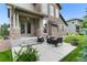 Welcoming front porch with seating, stone pillars, and well-maintained landscaping at 13673 Osage St, Broomfield, CO 80023