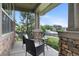 Inviting front porch features seating, stone accents, and serene neighborhood views at 13673 Osage St, Broomfield, CO 80023