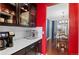 Bright kitchen featuring dark wood cabinets, subway tile backsplash, and stainless steel appliances at 13673 Osage St, Broomfield, CO 80023