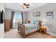 Charming bedroom featuring a wooden bed frame, natural light, and neutral decor at 13673 Osage St, Broomfield, CO 80023