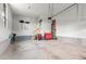 The spacious garage includes an overhead door, ample wall storage, and a clean, uncluttered space at 13673 Osage St, Broomfield, CO 80023