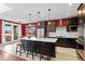 Modern kitchen featuring stainless steel appliances, a center island, and sleek cabinetry at 13673 Osage St, Broomfield, CO 80023