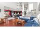 Open-concept living space with a great staircase, hardwood floors, and abundant natural light at 13673 Osage St, Broomfield, CO 80023