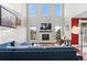 Bright living room with a vaulted ceiling, fireplace and a comfortable, oversized sofa at 13673 Osage St, Broomfield, CO 80023