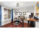 Bright home office with a large window, built-in shelving, and a comfortable workspace at 13673 Osage St, Broomfield, CO 80023