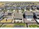 Aerial view of the house and neighborhood with solar panels at 26774 E Archer Ave, Aurora, CO 80018