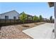 Landscaped backyard with patio and modern fence at 26774 E Archer Ave, Aurora, CO 80018