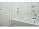 Clean bathroom with bathtub and shelving at 26774 E Archer Ave, Aurora, CO 80018