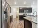 Kitchen with stainless steel appliances and granite countertops at 26774 E Archer Ave, Aurora, CO 80018