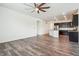 Spacious living room with hardwood floors and kitchen view at 26774 E Archer Ave, Aurora, CO 80018