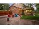Charming backyard with outdoor seating, string lights, and a well-manicured lawn at 11796 W 53Rd Pl, Arvada, CO 80002