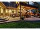 Outdoor patio with ambient lighting and lounge furniture, perfect for relaxing and entertaining at 11796 W 53Rd Pl, Arvada, CO 80002