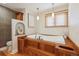 Bathroom features a built in wood tub with wooden stairs leading up to the tub at 11796 W 53Rd Pl, Arvada, CO 80002