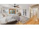 Large bright bedroom with beautiful hard wood floors, ceiling fan and access to the outside at 11796 W 53Rd Pl, Arvada, CO 80002